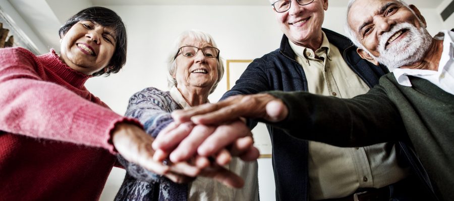 Group of senior friends support concept