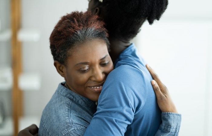 African Teen Support For Elderly Mature Mother